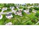 Beautiful aerial view of a neighborhood featuring lush greenery, water views, and well-maintained homes at 5523 Gainesway Dr, Greenwood, IN 46142