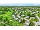 Picturesque aerial shot of a residential neighborhood featuring mature trees, manicured lawns, and cul-de-sac streets at 5523 Gainesway Dr, Greenwood, IN 46142