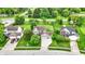 A beautiful aerial view shows a house with a green lawn, a two car garage and a brick house nearby at 5523 Gainesway Dr, Greenwood, IN 46142