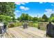 Relax on the spacious deck with outdoor seating and a tranquil backyard view at 5523 Gainesway Dr, Greenwood, IN 46142