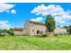 The backyard features a private deck, mature trees, and fully-fenced perimeter at 5523 Gainesway Dr, Greenwood, IN 46142