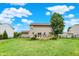 Enjoy your backyard with a spacious deck, great lawn, and fully-fenced perimeter at 5523 Gainesway Dr, Greenwood, IN 46142