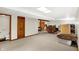 Spacious finished basement with new carpet, a separate toilet room, and ample storage space at 5523 Gainesway Dr, Greenwood, IN 46142
