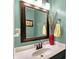 Bathroom featuring decorative plants, a mirror, and a vanity with a white basin sink at 5523 Gainesway Dr, Greenwood, IN 46142
