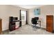 Bright bedroom featuring neutral walls, plush carpet, and two work stations with computer setups at 5523 Gainesway Dr, Greenwood, IN 46142
