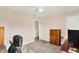 A spacious room with neutral walls and carpet, featuring a closet and built-in wooden storage at 5523 Gainesway Dr, Greenwood, IN 46142