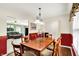 Traditional dining room with wood table, chairs, and view into the living room at 5523 Gainesway Dr, Greenwood, IN 46142