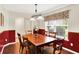 Traditional dining room featuring a wood table, six chairs, and natural light at 5523 Gainesway Dr, Greenwood, IN 46142