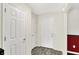 Bright entryway featuring tile floors, white walls, and white doors at 5523 Gainesway Dr, Greenwood, IN 46142