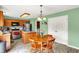 Bright kitchen features a dining area, stainless steel appliances, and ample storage with a modern island at 5523 Gainesway Dr, Greenwood, IN 46142