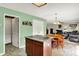 Open-concept design with kitchen island and a view into the living room creates an inviting and functional space at 5523 Gainesway Dr, Greenwood, IN 46142