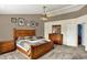 Spacious bedroom featuring a ceiling fan, warm color tones and ample furniture at 5523 Gainesway Dr, Greenwood, IN 46142