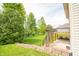 View of stone retaining wall and deck at 6039 Chinkapin Dr, Columbus, IN 47201