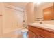 Standard full bathroom with shower and tub, wood vanity, and neutral tile floor at 6039 Chinkapin Dr, Columbus, IN 47201