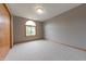 Bright bedroom with large window offering backyard views and a double-door closet at 6039 Chinkapin Dr, Columbus, IN 47201