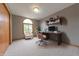 Comfortable home office with natural light, a chair, and a modern desk at 6039 Chinkapin Dr, Columbus, IN 47201
