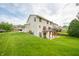 Exterior view of a home with well-maintained lawn and landscaping, siding, plus a wooden deck at 6039 Chinkapin Dr, Columbus, IN 47201