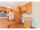 Efficient kitchen features wooden cabinets, modern appliances, and hardwood floors at 6039 Chinkapin Dr, Columbus, IN 47201