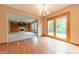 Open-concept living room with fireplace, built-in shelves and cabinets, and sliding doors to a deck at 6039 Chinkapin Dr, Columbus, IN 47201