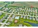 Wide aerial view of a community with many homes, a pool, and recreational areas near a pond, highlighted with a location pin at 6212 N Woods Edge Dr, McCordsville, IN 46055