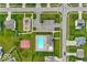 Detailed aerial shot of community amenities including a pool, playground, parking, and green spaces at 6212 N Woods Edge Dr, McCordsville, IN 46055