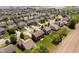 Expansive aerial view of a new housing development featuring manicured lawns and tree-lined streets in a suburban setting at 6212 N Woods Edge Dr, McCordsville, IN 46055