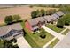 An aerial view of the red home, nestled in a well-planned residential community at 6212 N Woods Edge Dr, McCordsville, IN 46055