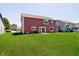 Expansive backyard with lush lawn, and vinyl-sided two-story home at 6212 N Woods Edge Dr, McCordsville, IN 46055