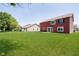 Spacious backyard featuring a lush green lawn and exterior view of the home at 6212 N Woods Edge Dr, McCordsville, IN 46055