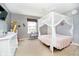 Charming bedroom with modern decor, large windows, and a canopy bed at 6212 N Woods Edge Dr, McCordsville, IN 46055