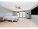 Primary bedroom suite boasting abundant natural light, neutral colors and carpeting at 6212 N Woods Edge Dr, McCordsville, IN 46055