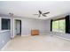 Spacious room with neutral walls, large window and carpeting at 6212 N Woods Edge Dr, McCordsville, IN 46055