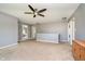 Large living space featuring a ceiling fan and view to another room at 6212 N Woods Edge Dr, McCordsville, IN 46055