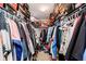 Walk-in closet with dual rods and shelves above filled with shoes and clothing at 6212 N Woods Edge Dr, McCordsville, IN 46055