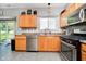 Updated kitchen boasting stainless appliances, including dishwasher and range, with tiled floor at 6212 N Woods Edge Dr, McCordsville, IN 46055