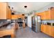 Bright kitchen with stainless steel refrigerator, range, microwave, and light-colored cabinets at 6212 N Woods Edge Dr, McCordsville, IN 46055