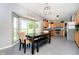 Eat-in kitchen with bright dining area, stainless appliances, tile floors, and gray walls at 6212 N Woods Edge Dr, McCordsville, IN 46055