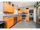 Well-lit kitchen featuring stainless steel appliances, custom cabinets and eat-in breakfast area at 6212 N Woods Edge Dr, McCordsville, IN 46055
