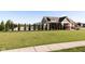 Beautiful pool with manicured lawn, ornamental trees, and attractive pool house in a well-kept community at 6212 N Woods Edge Dr, McCordsville, IN 46055