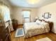 Charming bedroom with floral bedding and wood flooring at 641 Lawndale Dr, Plainfield, IN 46168