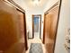 Hallway with closet space leading to a bathroom with walk-in shower at 641 Lawndale Dr, Plainfield, IN 46168