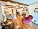 Relaxing living room with wooden floors, a brick fireplace, and comfortable seating at 641 Lawndale Dr, Plainfield, IN 46168