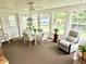 Bright sunroom with multiple windows, casual seating, and a ceiling fan at 641 Lawndale Dr, Plainfield, IN 46168