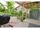 Backyard area showing a deck and home surrounded by lush green landscaping creating a private outdoor space at 6567 Kings Ct, Avon, IN 46123