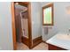 Bathroom with tub and shower with tile surround, window and vanity at 6567 Kings Ct, Avon, IN 46123