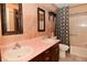 Bathroom featuring double sinks with framed mirrors, and a shower and bathtub combo at 6567 Kings Ct, Avon, IN 46123