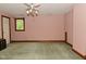 Bedroom featuring a ceiling fan, a door, and a small window at 6567 Kings Ct, Avon, IN 46123