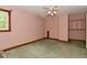 Bedroom featuring a ceiling fan and a window with wood trim at 6567 Kings Ct, Avon, IN 46123