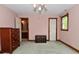 Bedroom featuring an ensuite bathroom, and a small closet at 6567 Kings Ct, Avon, IN 46123