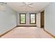 Bedroom with ceiling fan, 2 windows, and door to additional room at 6567 Kings Ct, Avon, IN 46123